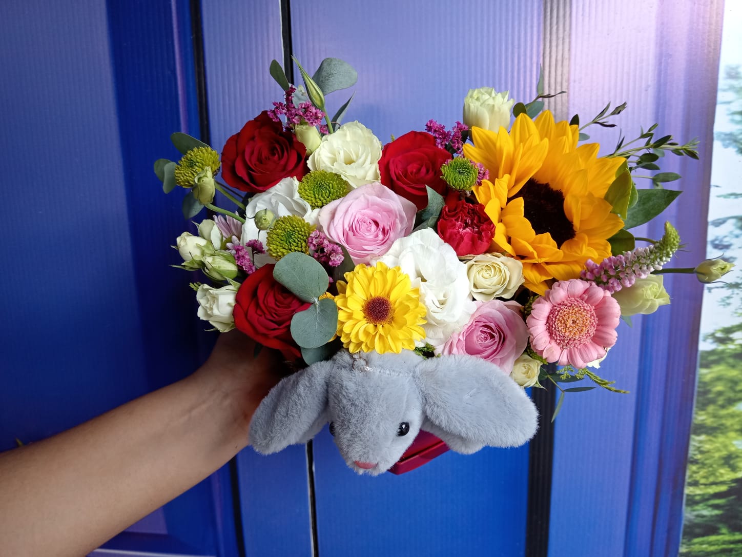 Corazón floral con peluche